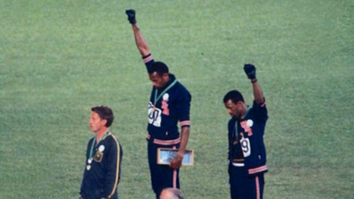 Tommie Smith and John Carlos raise a Black Power fist in 1968